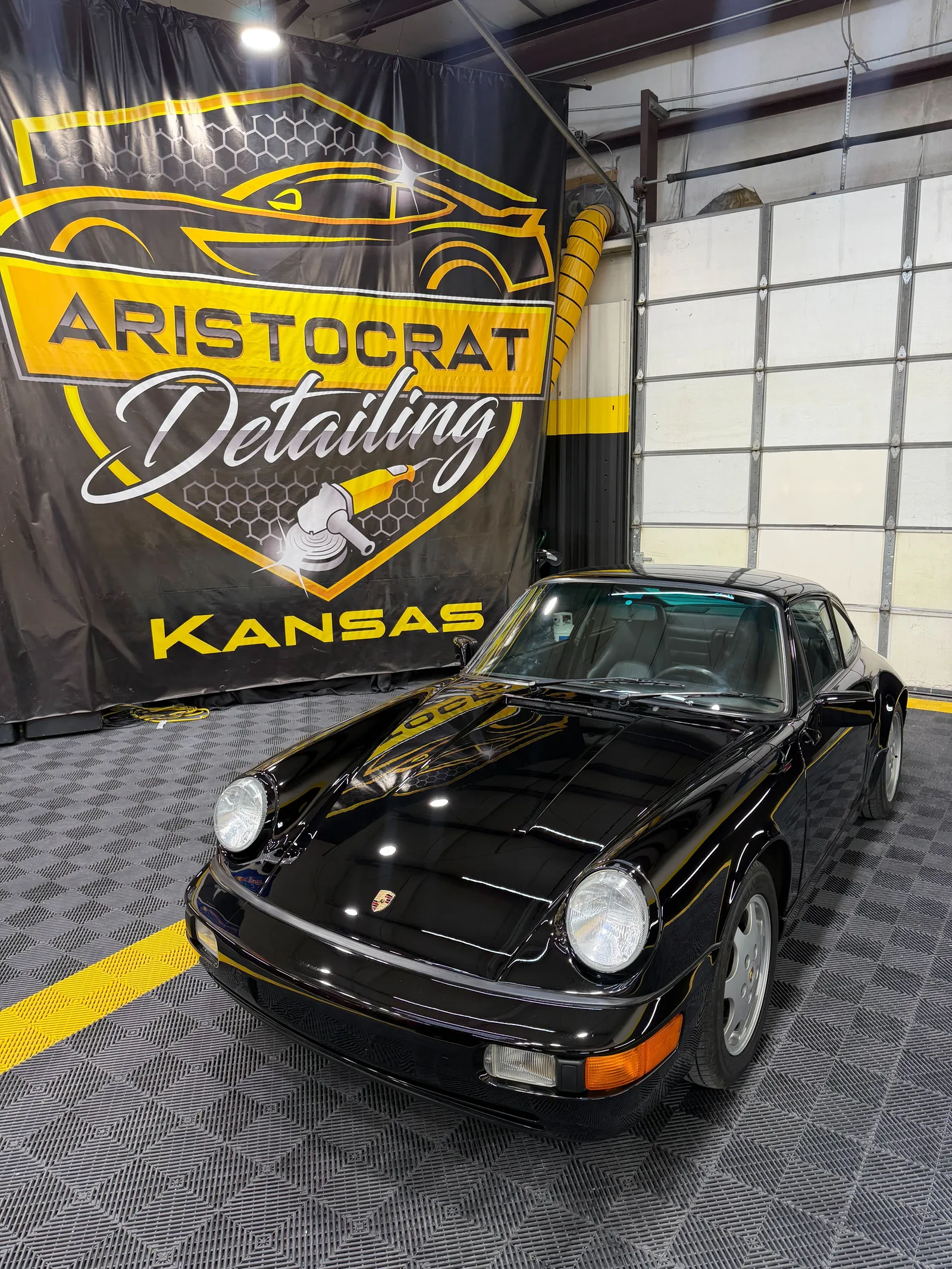 Faded trim before and after Feynlab Plastic V2 restoration at Aristocrat Detailing Lenexa KS