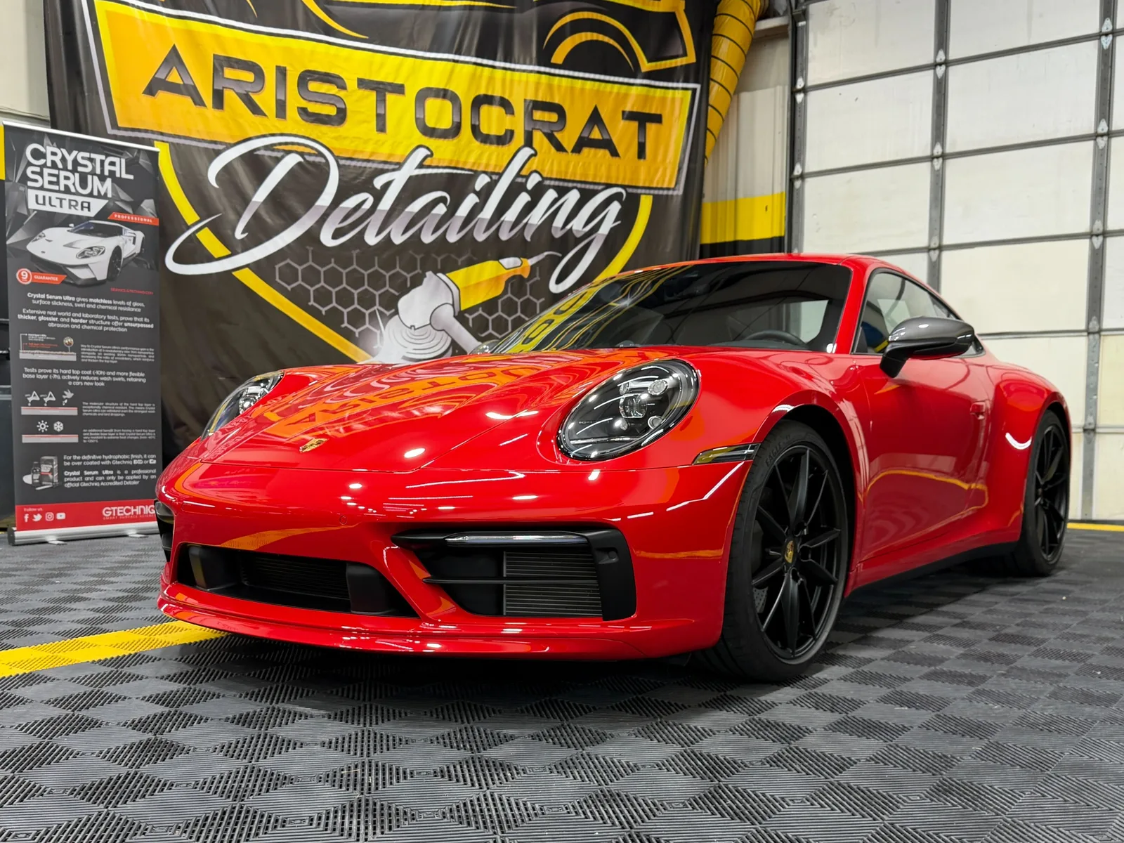 Paint correction on red Porsche at Aristocrat Detailing Kansas City